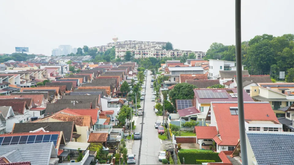 Rows of landed houses along a residential street, seen from above